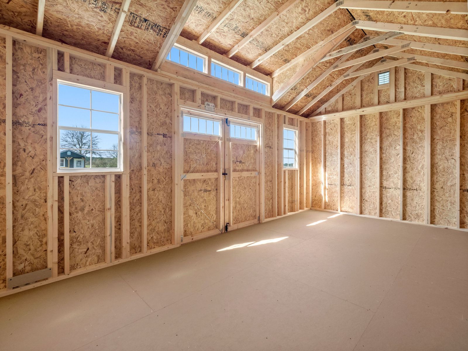 Inside a custom Stor-Mor building with windows and double doors
